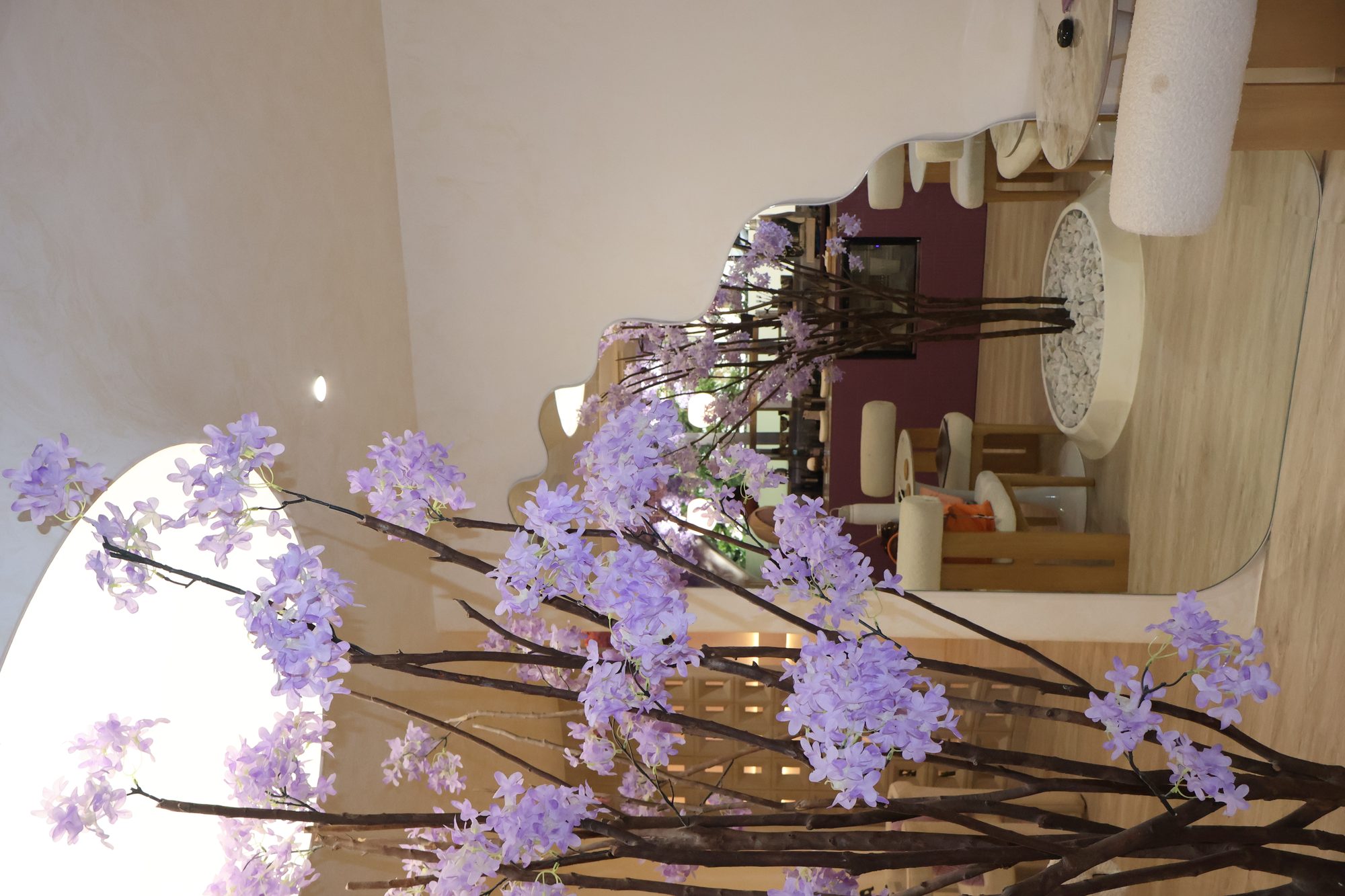 Interior of Lavande in Legaspi Village Makati, wisteria and arched mirror.